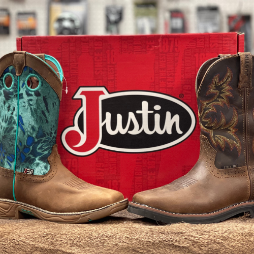 Justin boots on display in front of a branded shoe box.