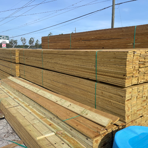 Stacked lumber boards.