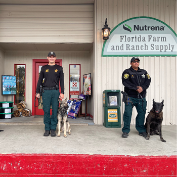 Local sheriffs standing outside of Florida Farm & Ranch with their K9's.