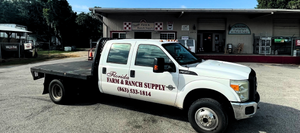 Florida Farm & Ranch Supply store front with a company branded truck parked in the front.